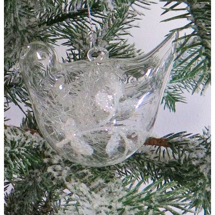 Glass bird shaped tree decoration with mistletoe.