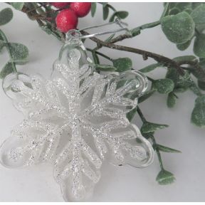 Clear glass snowflake decoration with white glitter detail.
